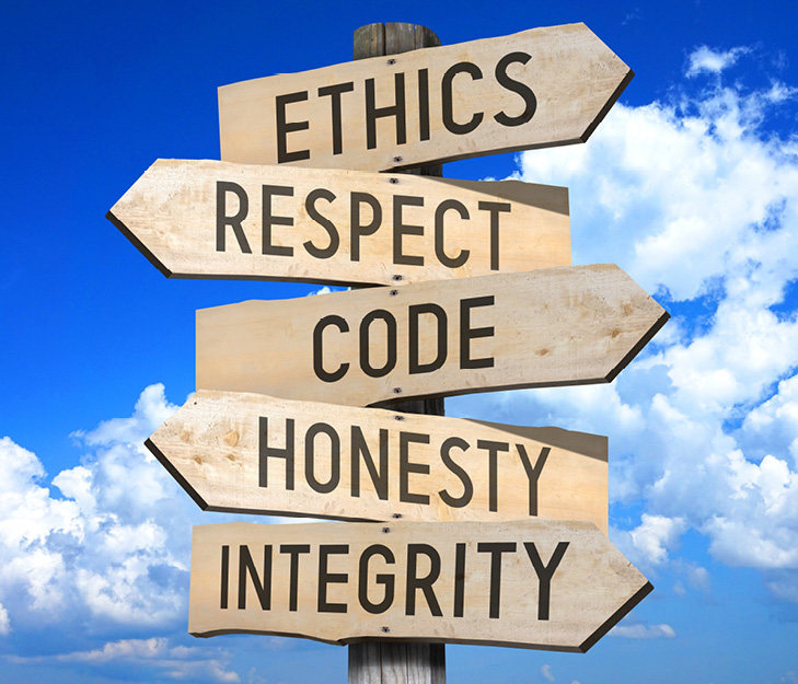 pole that has directional signs for ethics, respect, code, honesty, and integrity